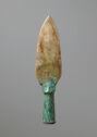 Polished gray, green and brown jade spear tip in a bronze shaft with turquoise inlay