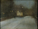A dark figure walks down a snowy street at night.