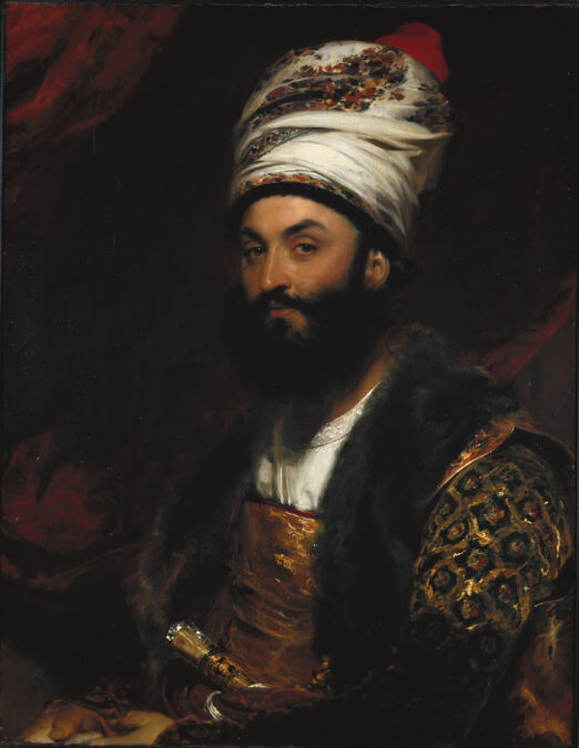 Portrait of a man seated, wearing a turban.
