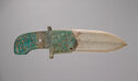 A blade of polished, carved jade, set in a bronze handle decorated with turquoise