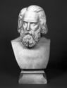 
A marble portrait bust depicts the head of an older man. 