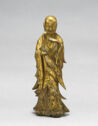A gilt bronze sculpture of a man in a robe.