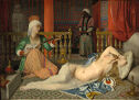 A nude woman reclines on the floor of an ornate room, while servants attend her