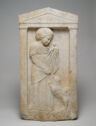 A marble relief portrays a young girl with a doll, a bird, and a small dog within an architectural pediment.