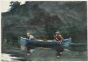 An older and younger man ride in a rowboat.