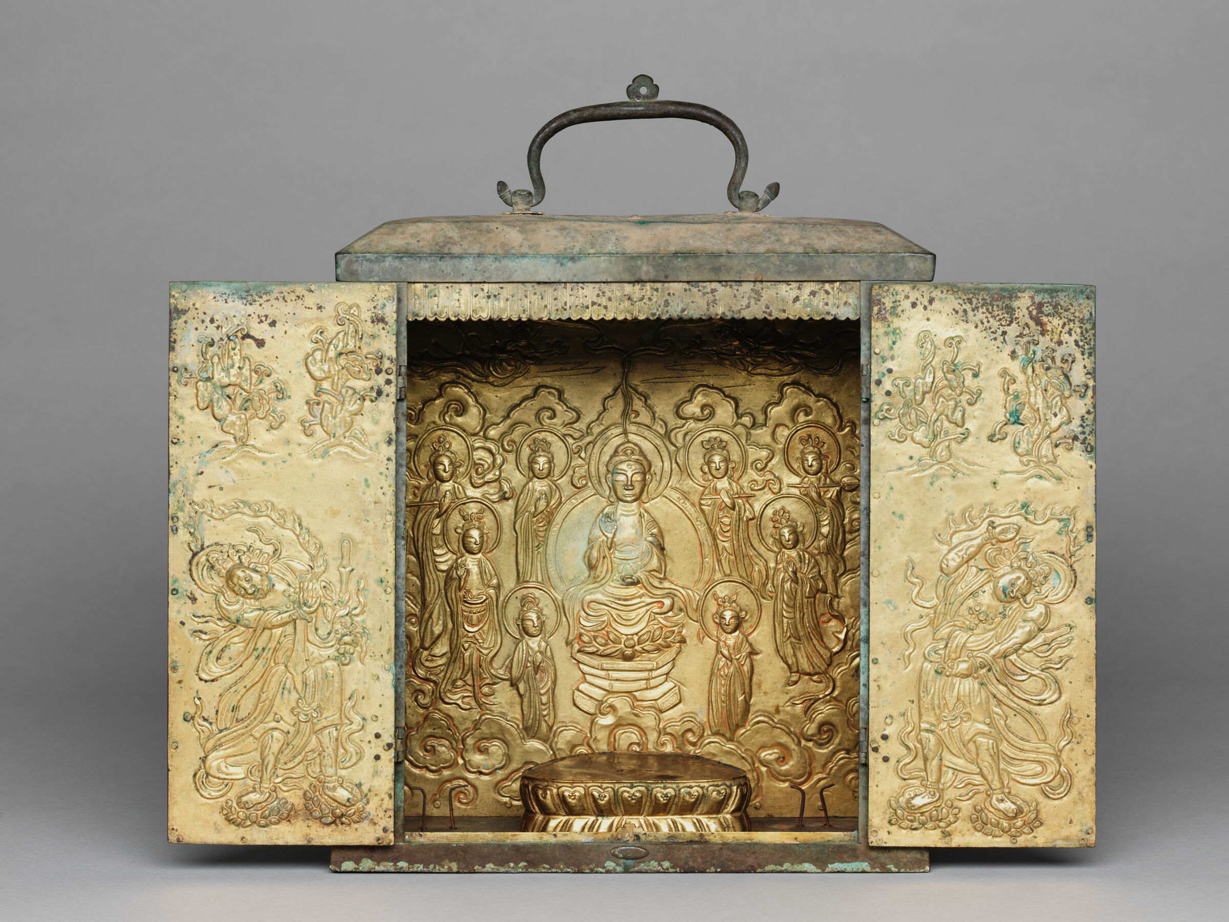 Portable Buddhist Shrine With Two Removable Standing Bodhisattvas, A Lotus Base For A Seated Buddha Image (Now Missing), A Repoussé Panel Depicting The Buddha Amitabha (Amit'abul), And Repoussé Panels On The Doors Representing Guardian Figures