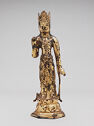 A gilt bronze sculpture of a man wearing a crown and standing on a pedestal.
