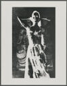 A black and white photograph of a woman in a dress superimposed over a case of bottles.