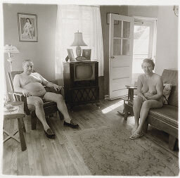 Retired Man And His Wife At Home In A Nudist Camp One Morning In N.j. 1963. On The Television Set Are Framed Photographs Of Each Other.