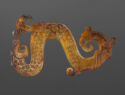 Resembling an S-shaped curve on its side, this ornament object is a combination of dragon, snake, and bird.