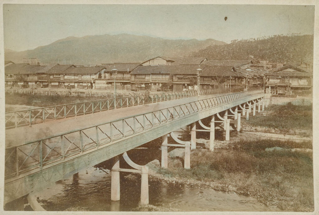 Untitled (Bridge With Buildings And Mountains In Background)