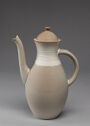 A glazed stoneware coffeepot in two colors.