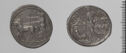 Both sides of an irregularly shaped silver-gray coin with relief decoration on each side.　