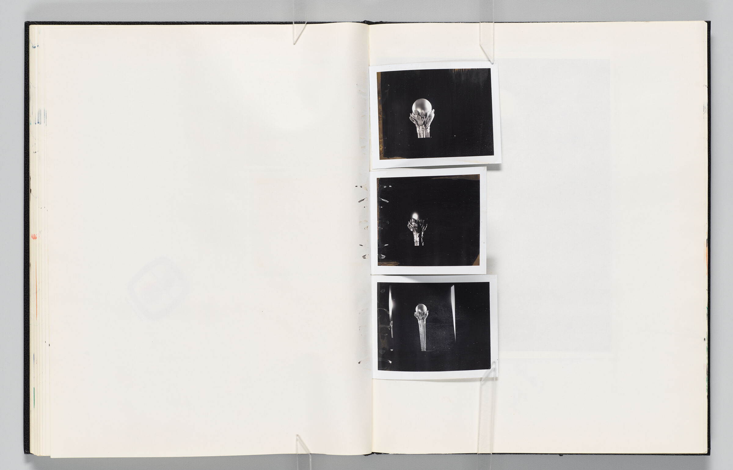 Untitled (Blank, Left Page); Untitled (Photographs Of Maquettes (Hands Holding Globe), Right Page)