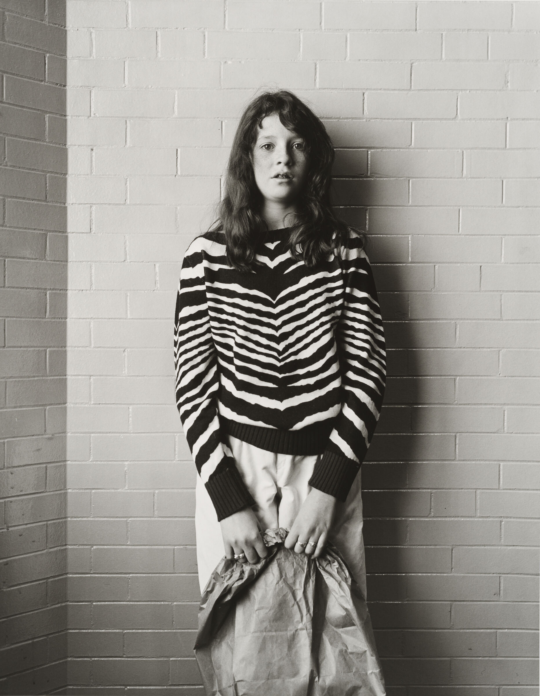 Girl With Zebra Stripes And Paper Bag