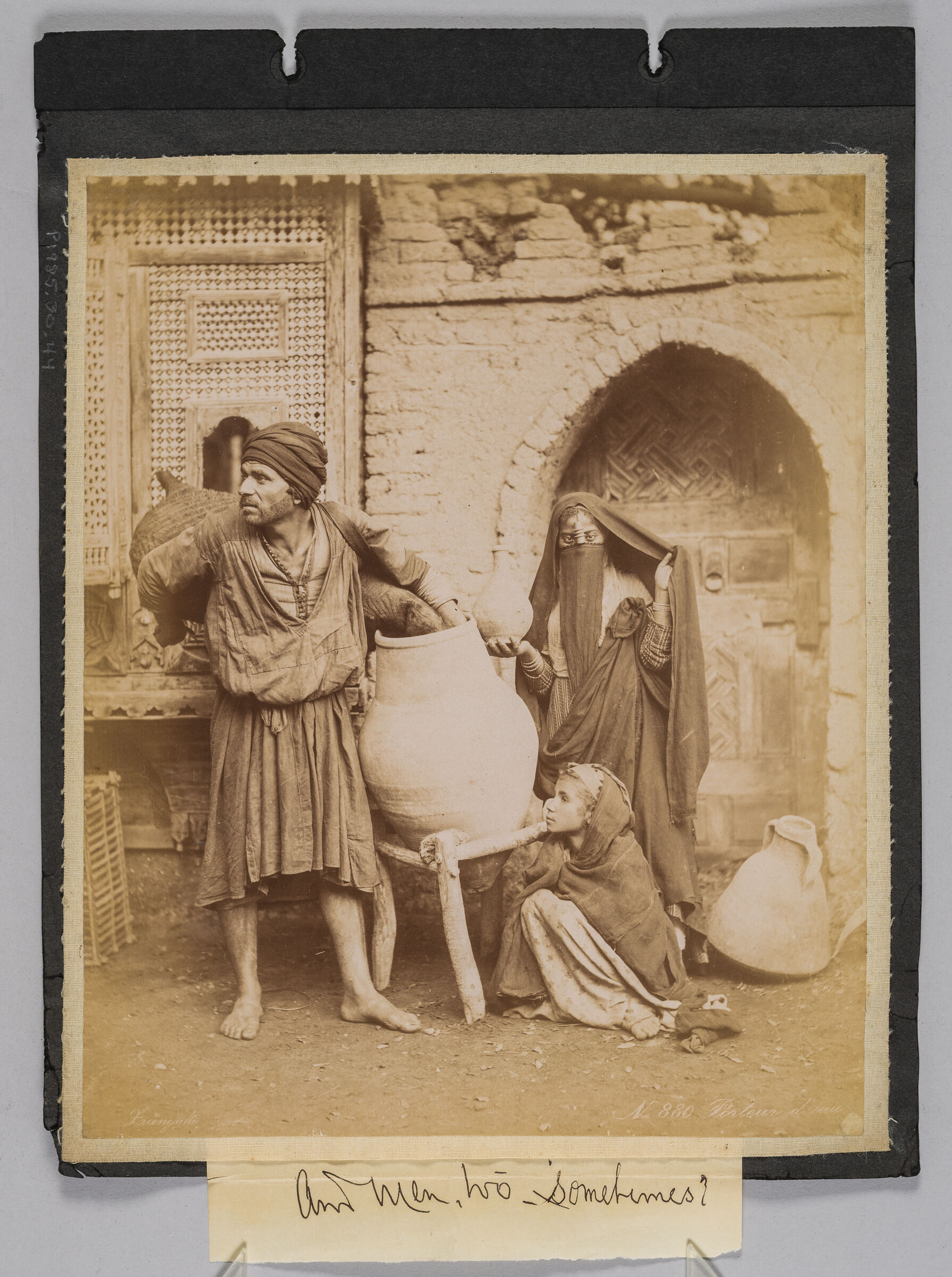 Untitled (Man Carrying Water, Veiled Woman, Child Kneeling On Ground)