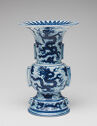 Flared white vase with blue painted dragon decoration