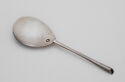 A silver spoon with a large bowl and very delicate handle.