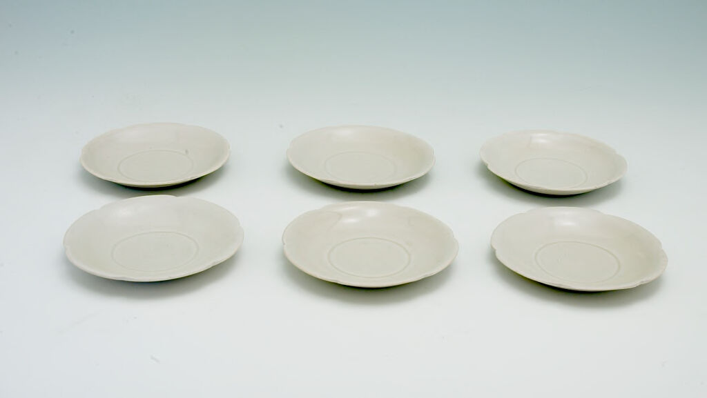 Six Small Dishes, Each With Notched Rim