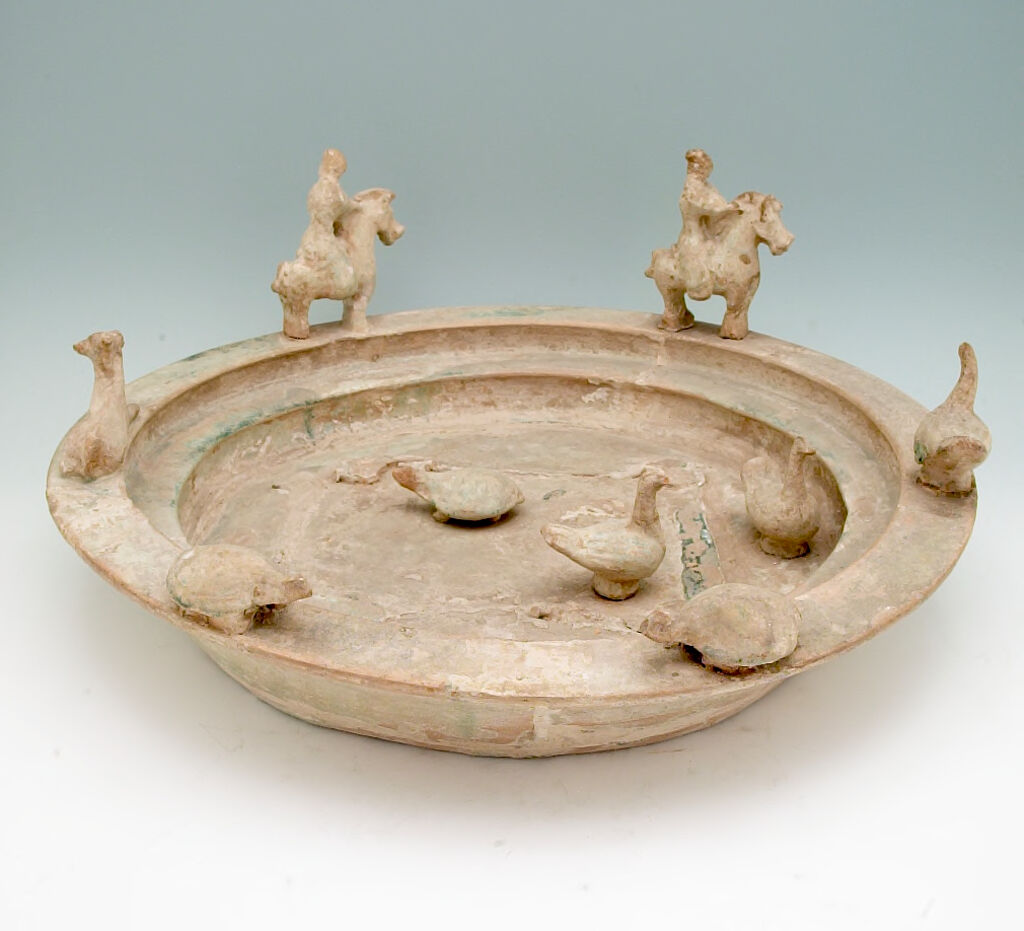 Section From A Tomb Furnishing In The Form Of A Three-Storied Watchtower (Base--Circular Moat With Two Equestrian Figures And Various Animals)