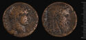 Both sides of an irregularly shaped bronze coin with relief decoration on each side.　