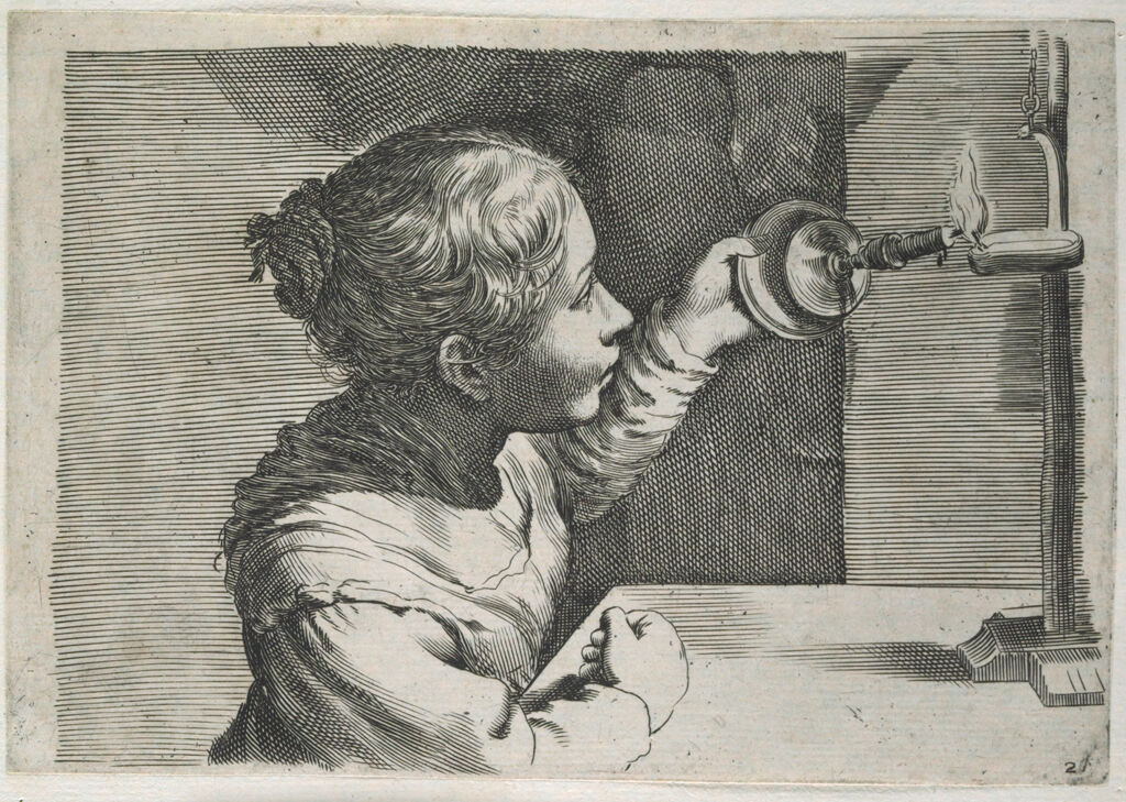 A Girl Lighting A Lamp