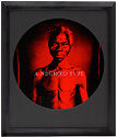 Series of four portraits of enslaved African American people rendered in red and black.