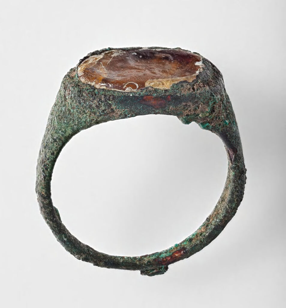 Ring With Orange Glass Gem Bearing Human Head