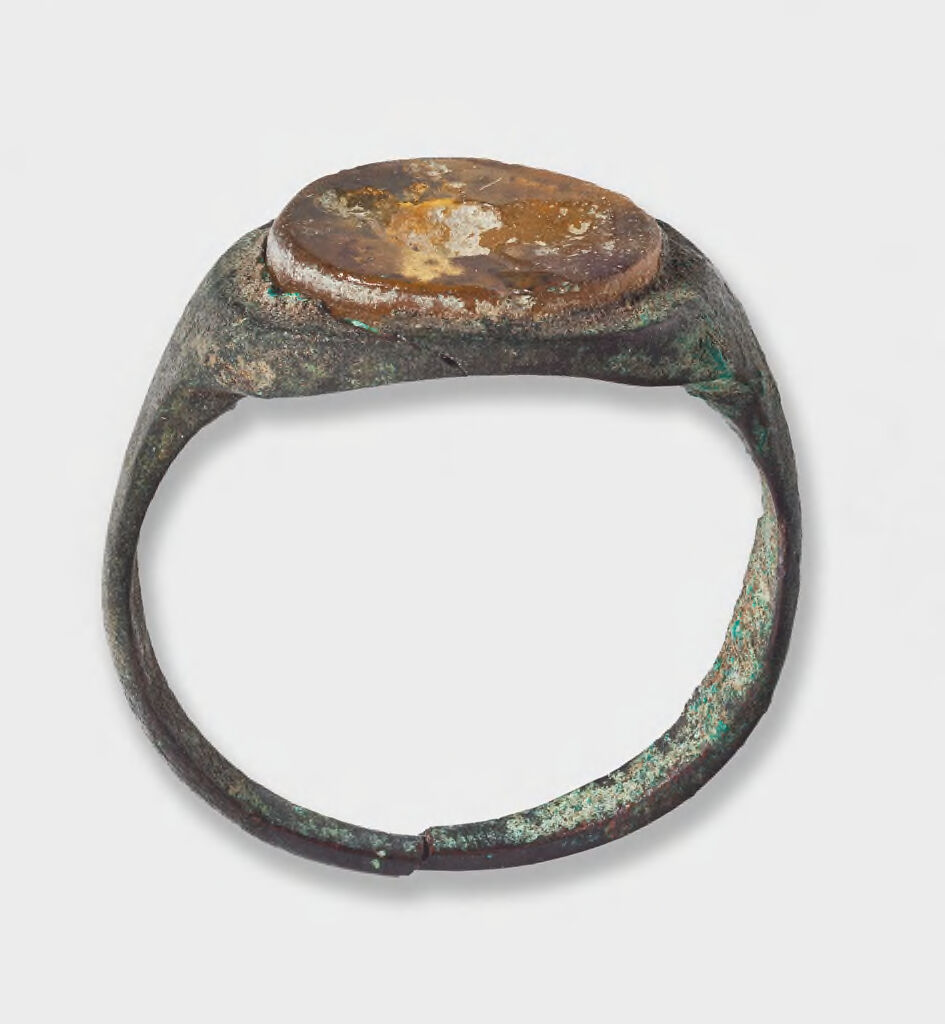 Ring With Yellow Glass Gem Bearing Standing Warrior