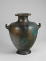 A vessel with several handles and a thick fluted spout.