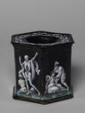 Six-sided enameled box painted with scenes of figures and animals.