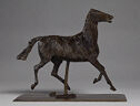 Three-dimensional bronze sculpture of a horse in motion, trotting in mid-air, all four legs are off the ground.