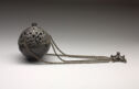 Spherical, dark metal censer with openwork lid and chains.