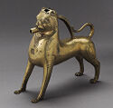 Brass water vessel in shape of standing lion with a spout at the mouth