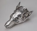 A silver wolf head with wide eyes and flat-back ears.