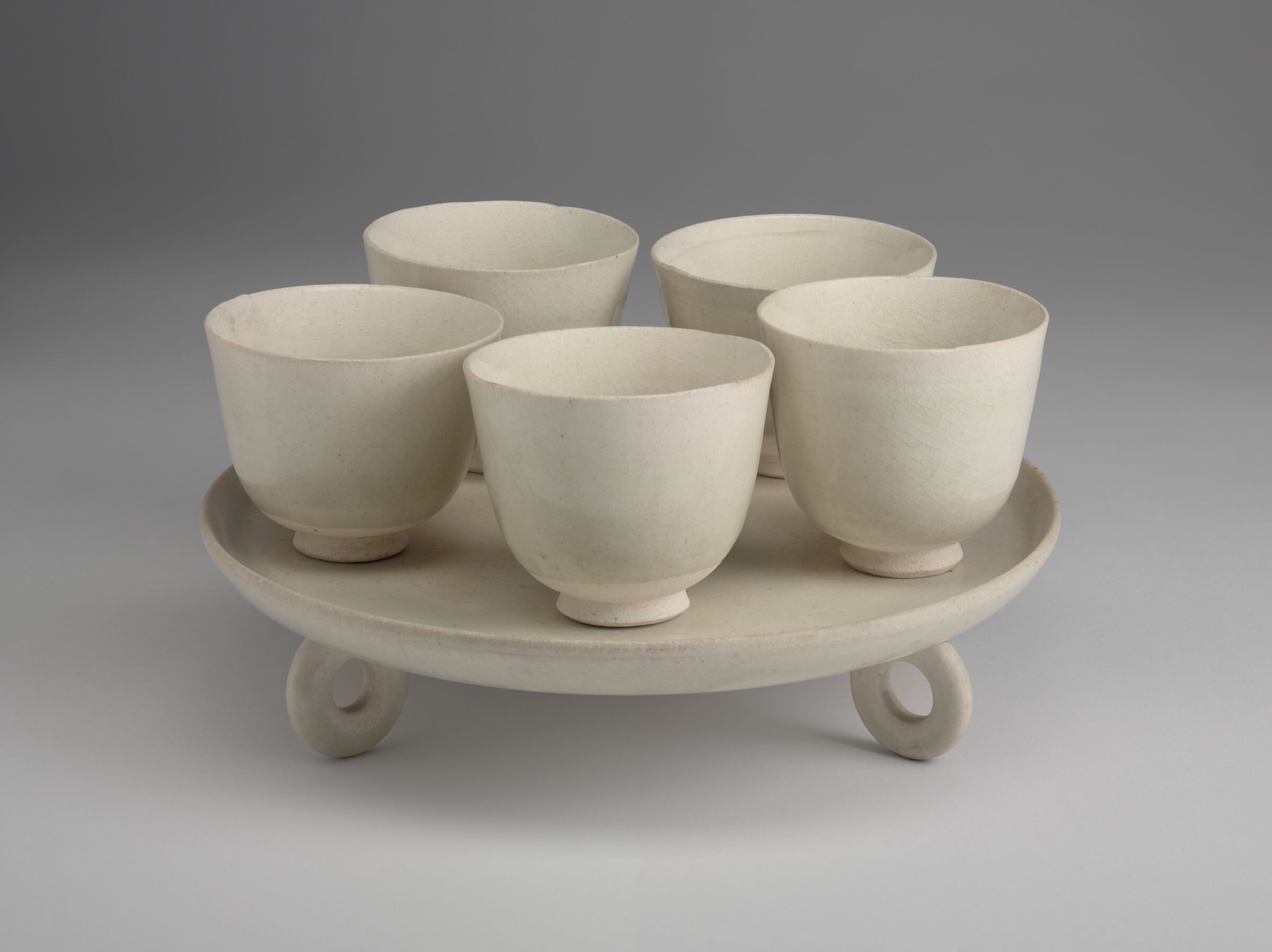 Circular Tray With Three Ring-Form-Feet And Five Cups