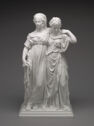 White ceramic full length sculpture of two women standing side by side