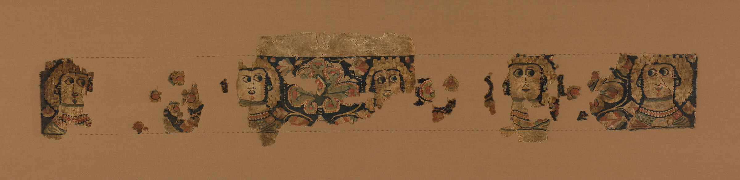 Fragments Of A Textile Hanging With Female Busts
