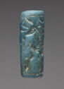 An intaglio bright blue, frit object in the shape of a cylinder. It is engraved with lines that form the shapes of a standing, winged horse and a person pulling on a bow and arrow. They are surrounded by other small engravings.