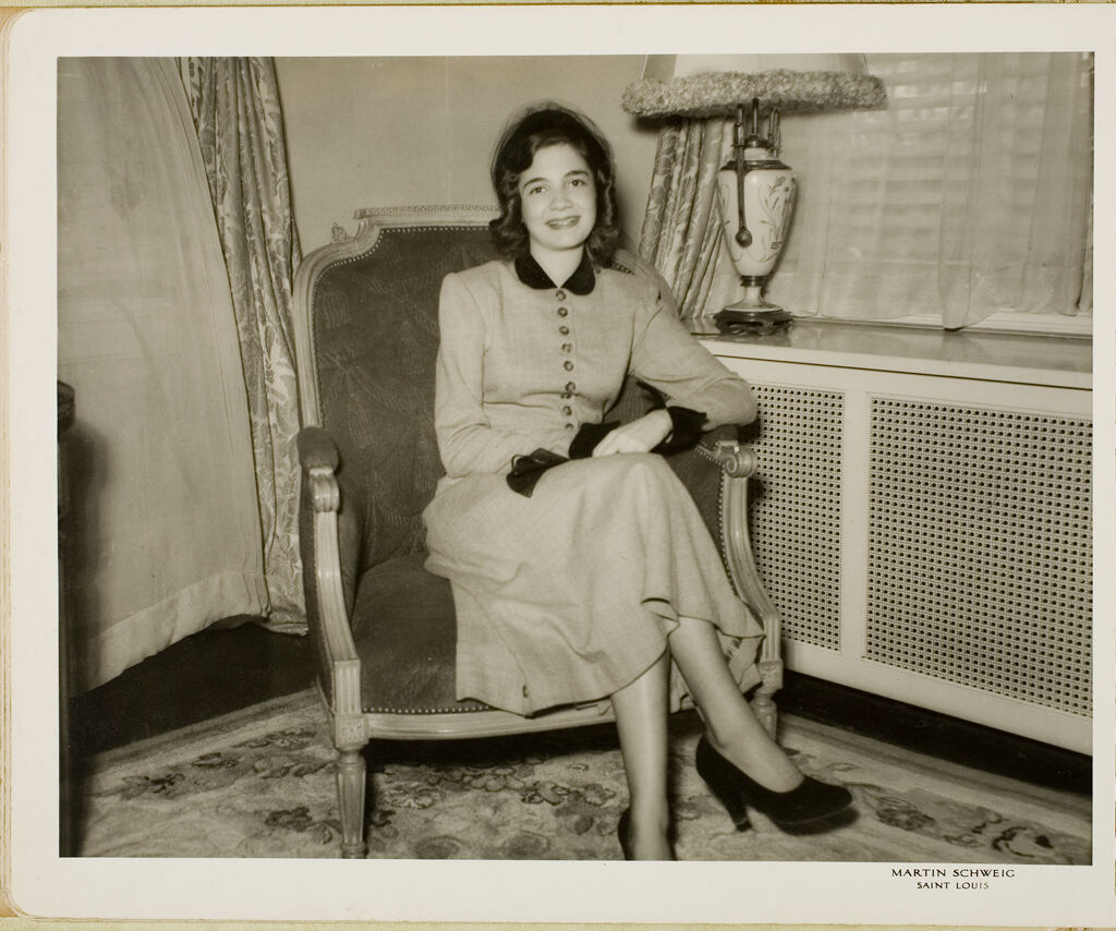 Untitled (Smiling Woman Seated In Chair)