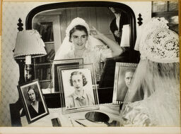 Untitled (Bride At Mirror Arranging Veil And Smiling)