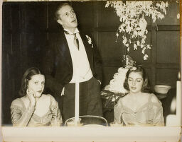 Untitled (Man Stands Between Two Seated Bridesmaids)