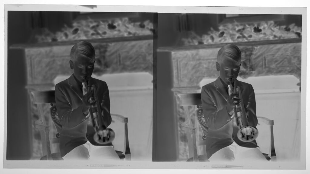 Untitled (Medium Format Images Of Boy Playing Trumpet In Front Of Fireplace)