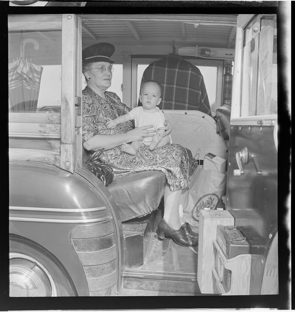Untitled (Elderly Woman In Sailor Hat Holding Baby)