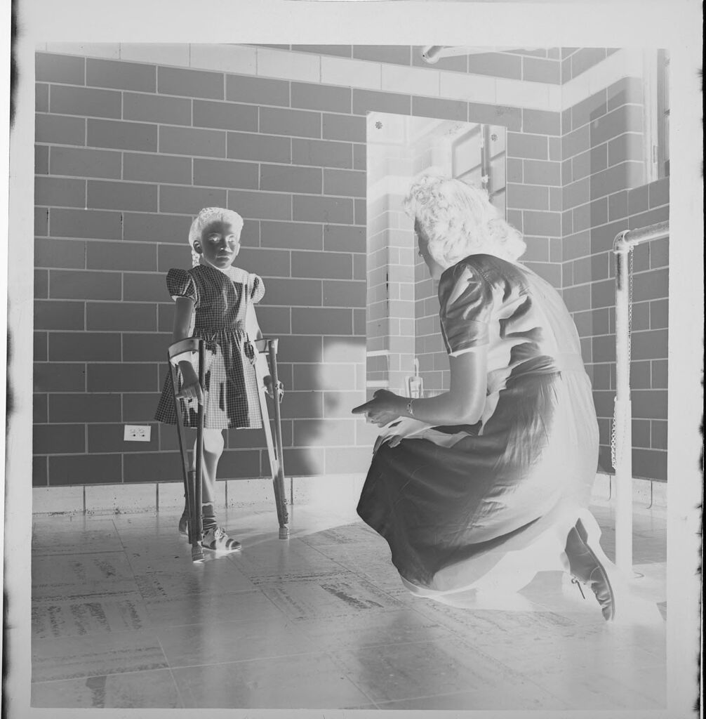 Untitled (Child On Crutches With Nurse)