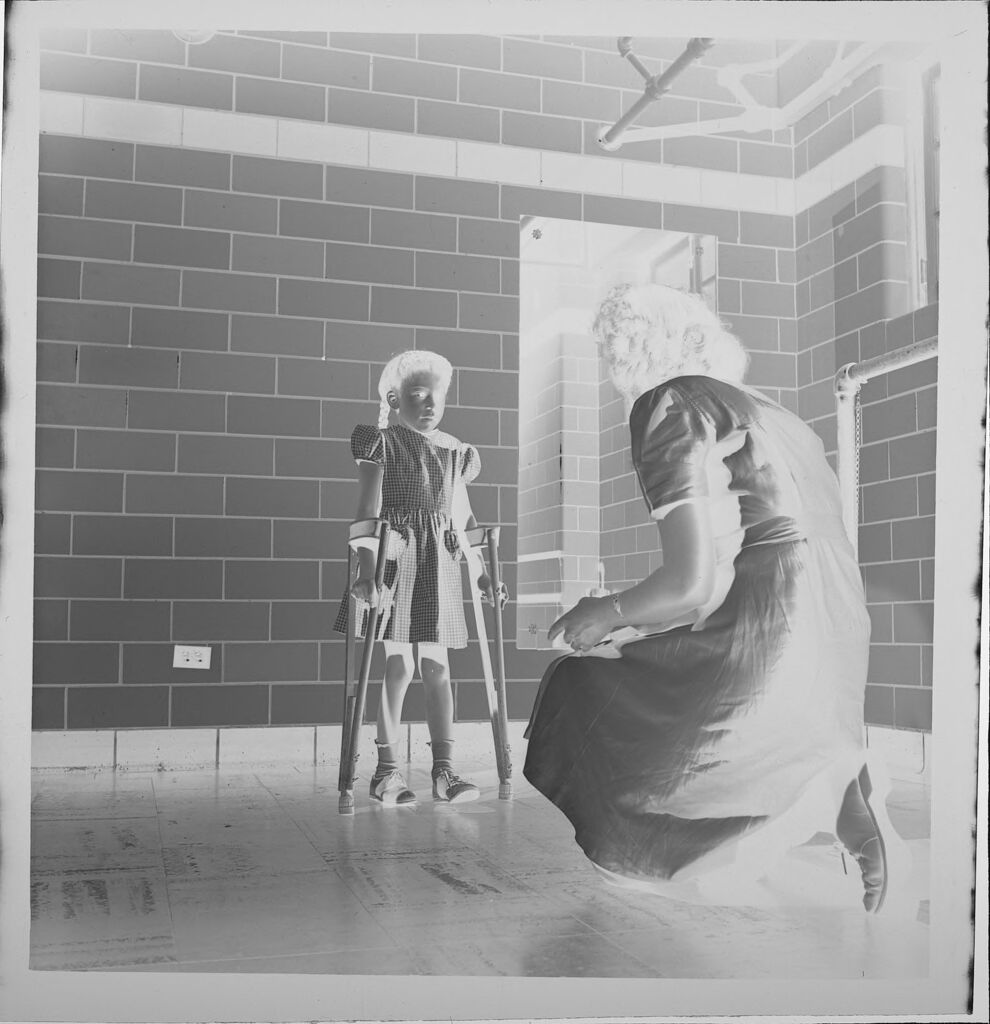 Untitled (Child On Crutches With Nurse)