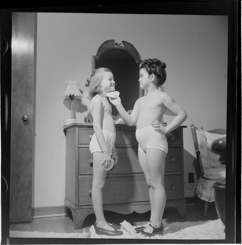 Untitled (Young Girls Playing Dress-Up And Putting On Make-Up)