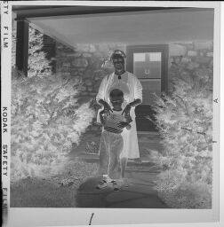 Untitled (Family In Front Of House)