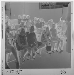 Untitled (Kids Sitting On Chairs In A Group)