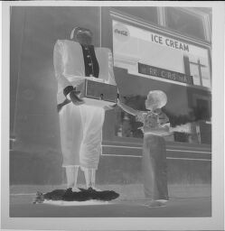 Untitled (Boy With Statue Outside Ice Cream Shop)